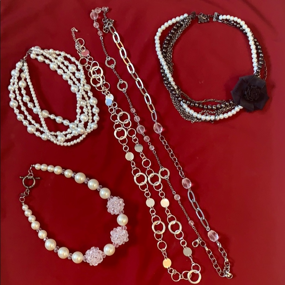 Black, white, silver lot of necklaces.